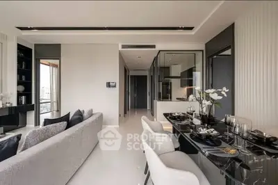 Luxurious modern living room with open kitchen and elegant dining area in high-rise apartment.