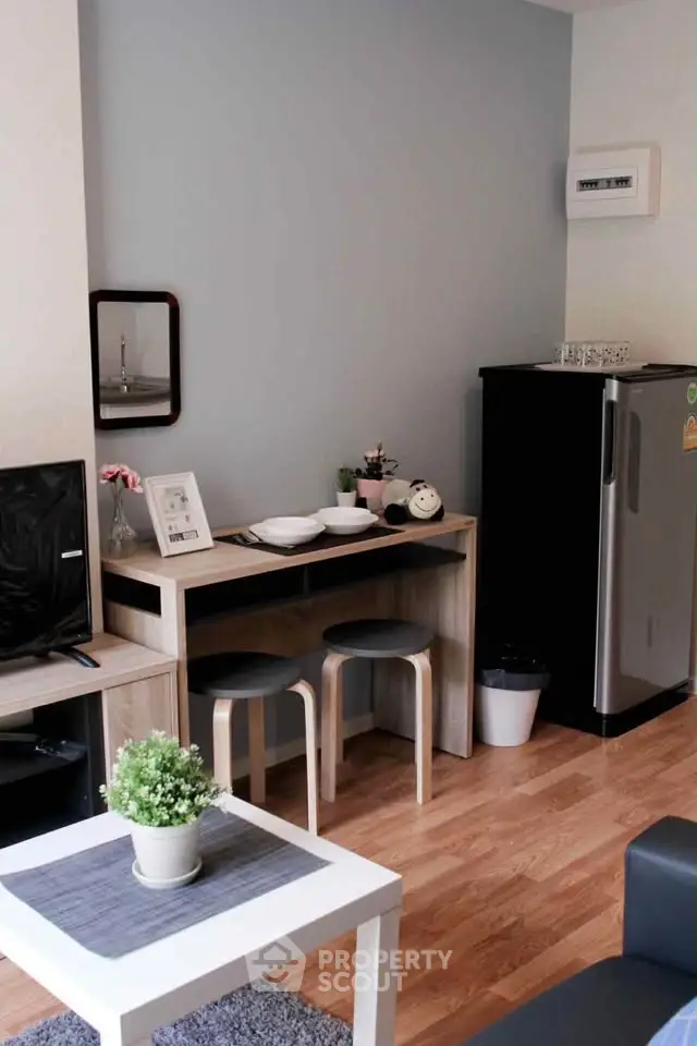 Chic modern living room with stylish furniture and compact kitchen area