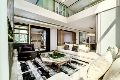 Luxurious modern living room with high ceilings and elegant decor
