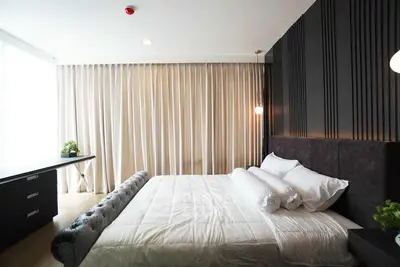 Luxurious modern bedroom with elegant decor and ample natural light