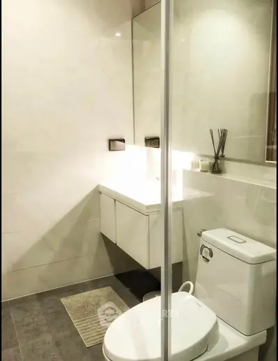 Modern bathroom with sleek design and elegant fixtures in a contemporary apartment.