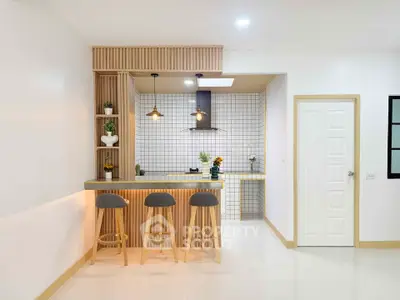 Modern kitchen with open layout and stylish bar seating