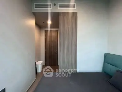 Modern bedroom with minimalist design and wooden door