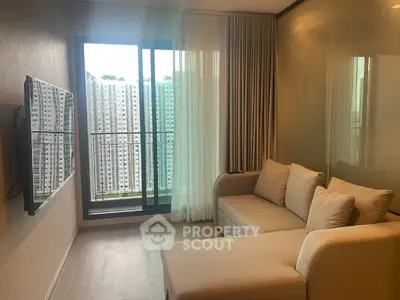 Modern living room with cozy sofa and large window offering city view