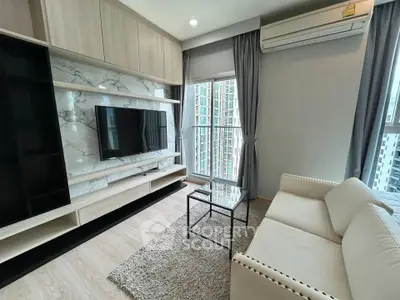 Modern living room with sleek design, featuring a wall-mounted TV, elegant sofa, and large window with city view.