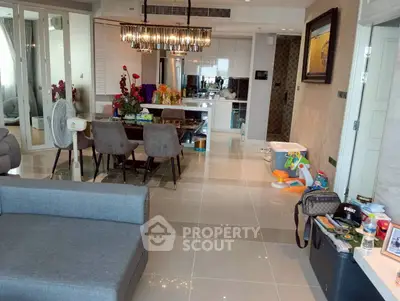 Modern open-plan living and dining area with stylish decor and contemporary furniture.