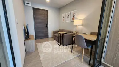 Modern living room with cozy sofa, stylish decor, and natural light, perfect for relaxation and entertainment.
