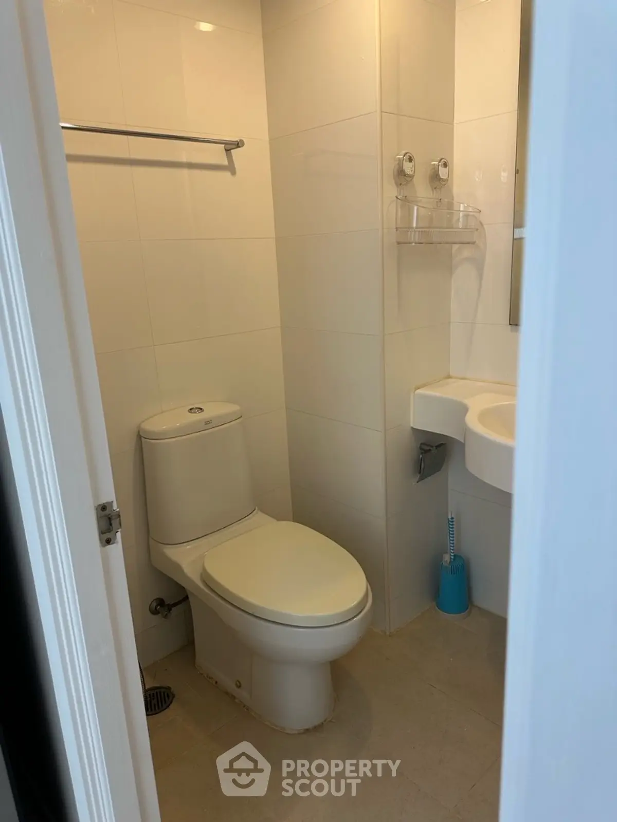 Compact modern bathroom with white fixtures and minimalist design