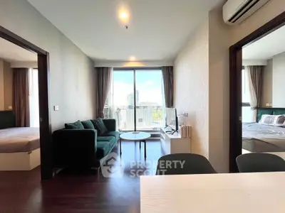 Spacious modern living room with balcony view in a stylish apartment