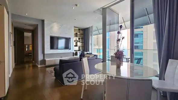 Luxurious modern living room with floor-to-ceiling windows and elegant decor