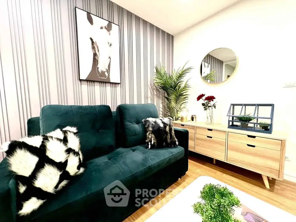 Stylish living room with modern decor, plush sofa, and chic wall art in a cozy apartment.
