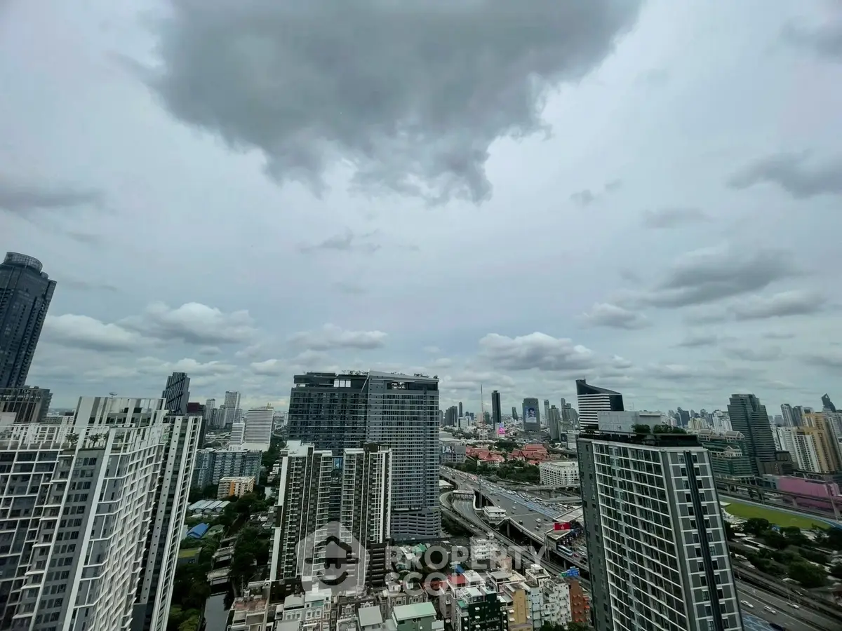 Stunning cityscape view from high-rise building showcasing urban skyline and architecture.