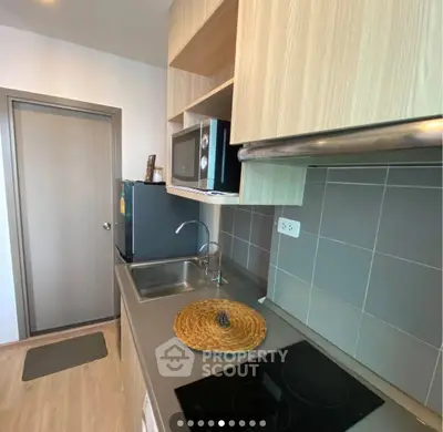 Modern kitchen with sleek appliances and stylish cabinetry