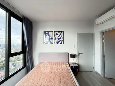 Modern bedroom with large window and city view, featuring stylish decor and natural light.