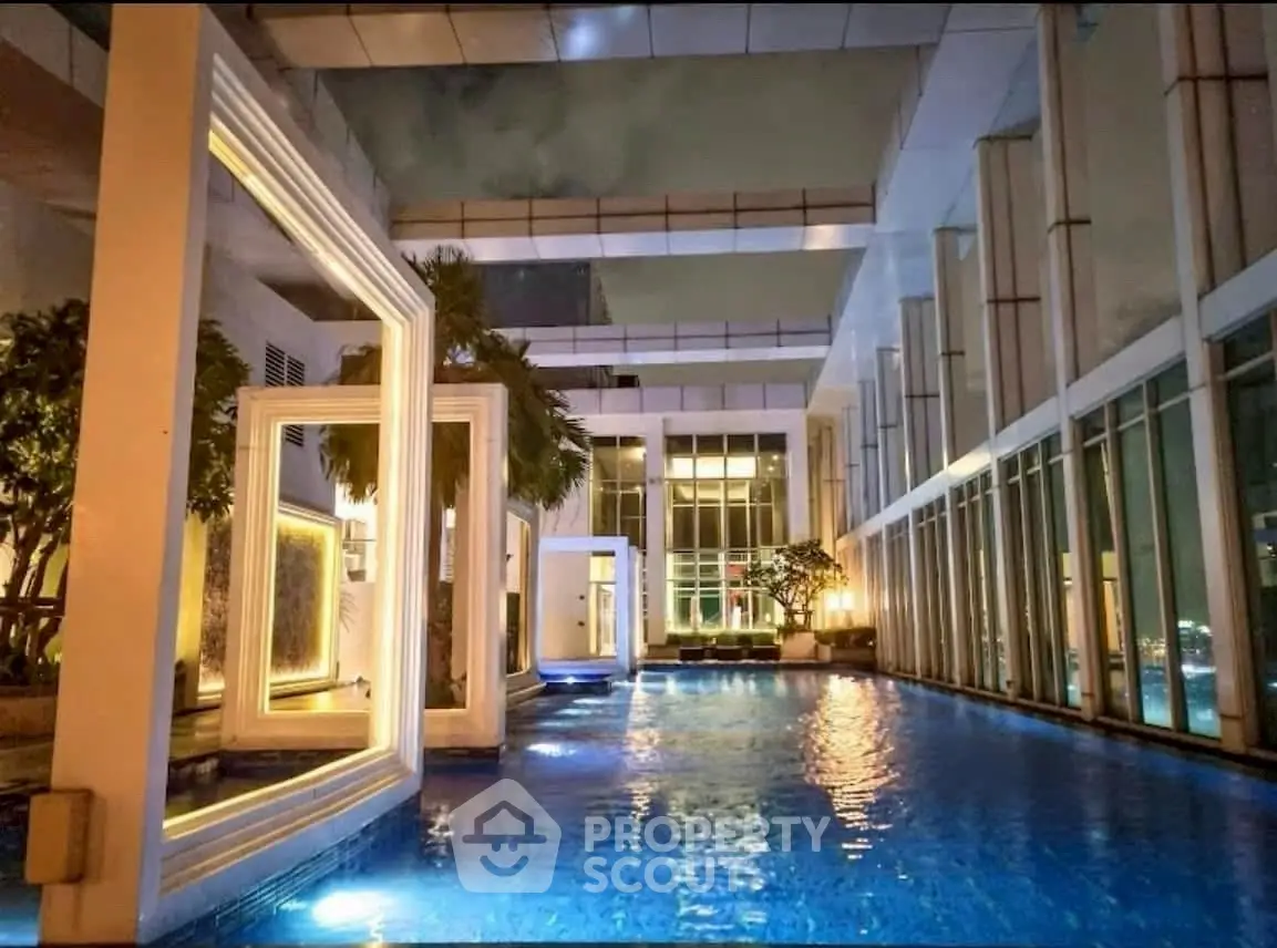 Luxurious rooftop pool with stunning architectural design and ambient lighting.
