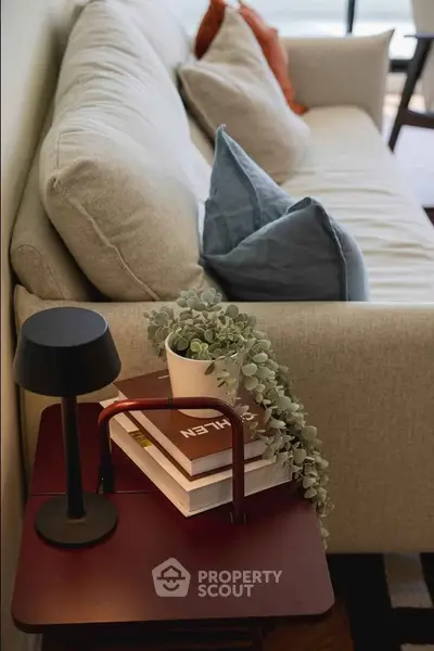 Stylish living room corner with cozy sofa and modern decor