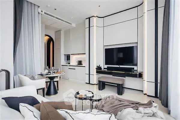 Luxurious modern living room with sleek design and integrated kitchen area.