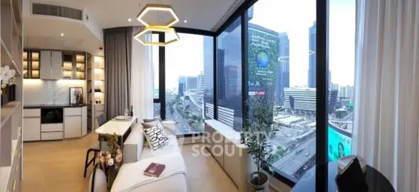 Modern living room with panoramic city view and stylish kitchen area.