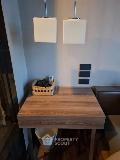 Cozy study nook with modern lighting and wooden desk