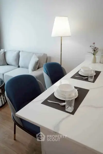 Modern living room with elegant dining area and stylish decor