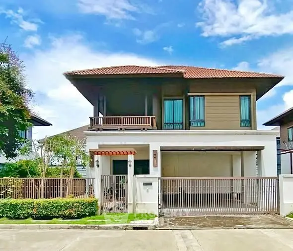Stunning two-story house with modern design and spacious balcony in a serene neighborhood.