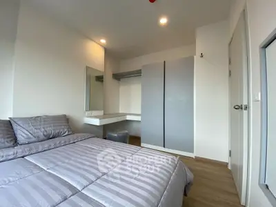 Modern bedroom with stylish decor and ample storage space
