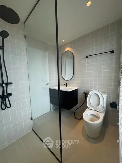 Modern bathroom with sleek fixtures and glass shower enclosure