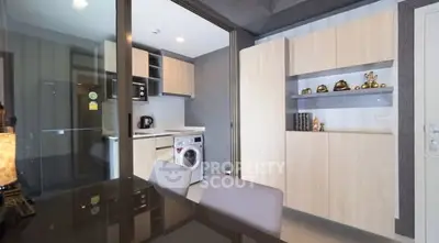 Modern kitchen with washing machine and sleek cabinetry