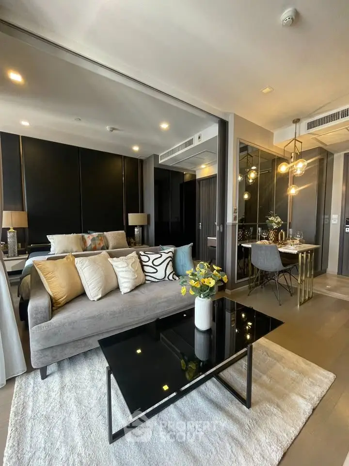 Modern living room with elegant decor and dining area in luxury apartment