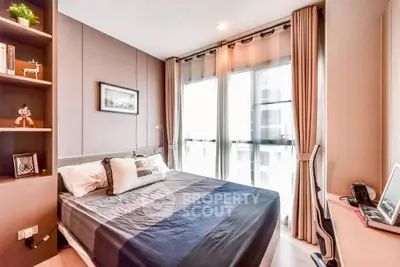 Modern bedroom with large windows and stylish decor in a high-rise apartment.