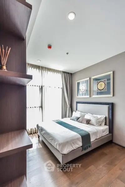 Modern bedroom with stylish decor and natural light