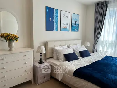 Charming bedroom with elegant decor, featuring a cozy bed, stylish dresser, and serene wall art.