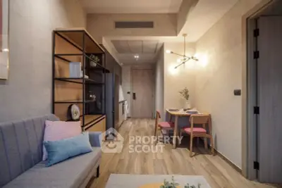 Modern living room with cozy dining area and stylish lighting in a contemporary apartment.