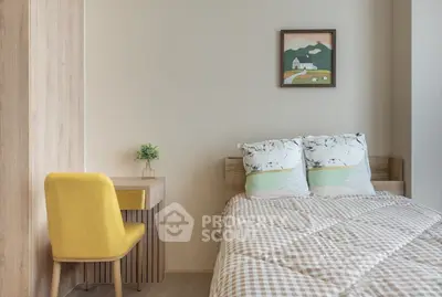 Cozy bedroom with modern decor and a stylish yellow chair, perfect for relaxation and comfort.