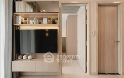 Modern living room with sleek TV unit and wooden accents