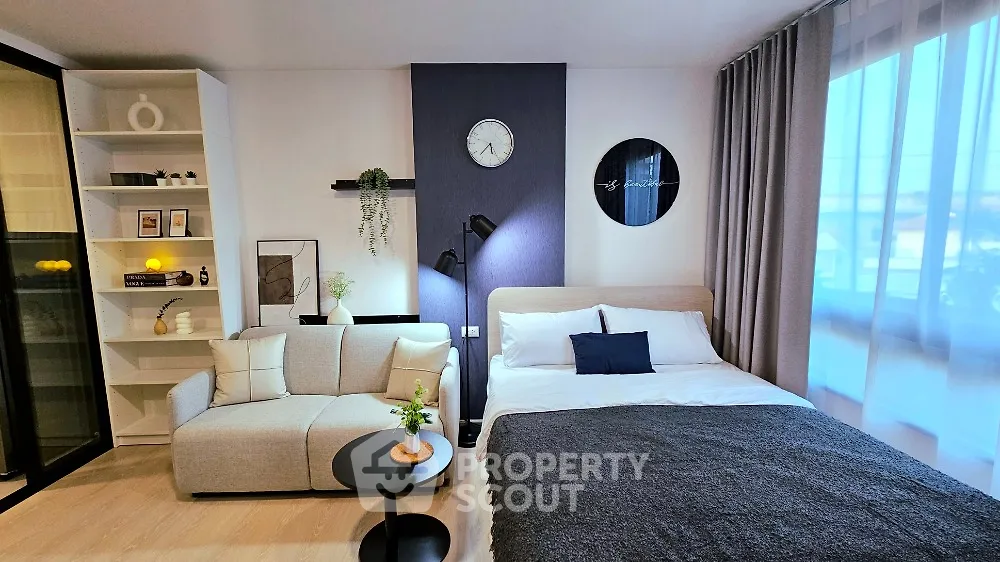 Modern studio apartment with cozy living area and stylish decor