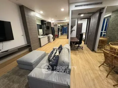 Spacious modern living room with open layout and stylish furniture in a contemporary apartment.