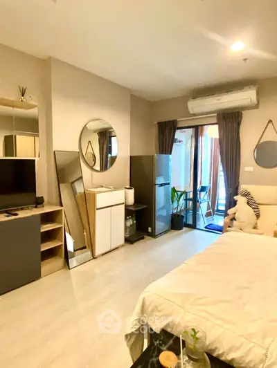 Modern living room with stylish decor and balcony access