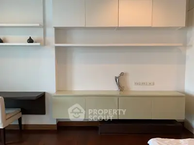 Modern interior with sleek cabinetry and elegant decor in a stylish living space.