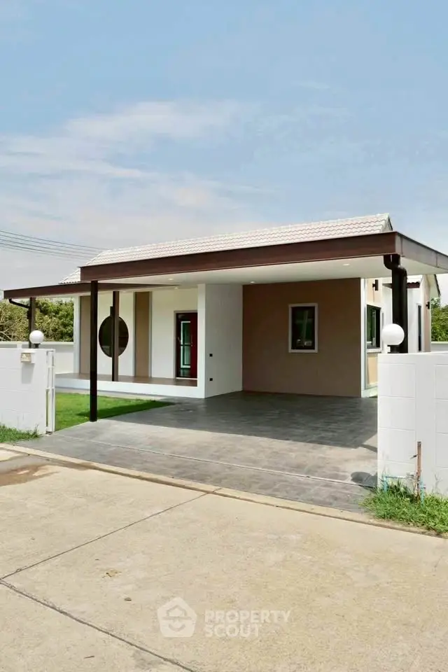 Modern single-story house with carport and minimalist design