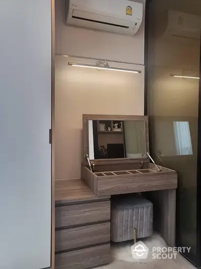 Elegant bedroom corner with vanity table and modern air conditioning unit.