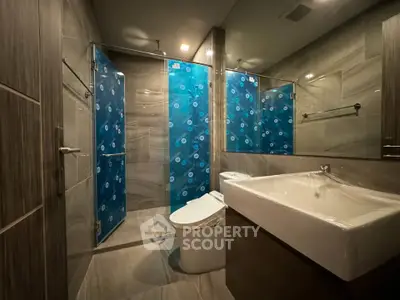 Modern bathroom with sleek design and glass shower enclosure