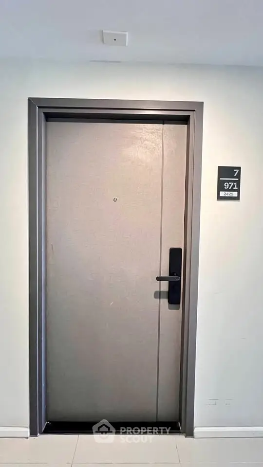 Modern apartment door with sleek design and room number signage, ideal for urban living.
