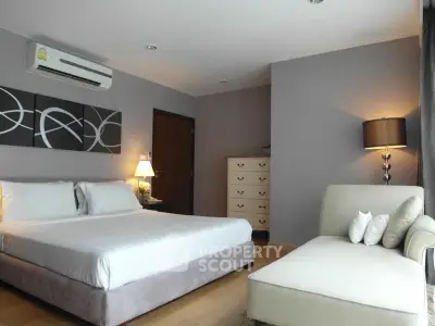 Spacious modern bedroom with elegant decor and cozy lighting