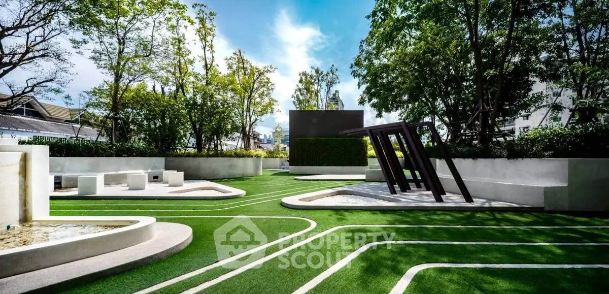 Stunning modern garden with unique design and lush greenery in urban setting.