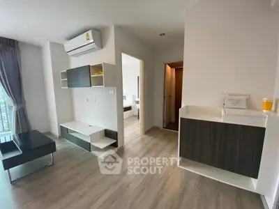 Modern living room with sleek furniture and air conditioning in a stylish apartment.