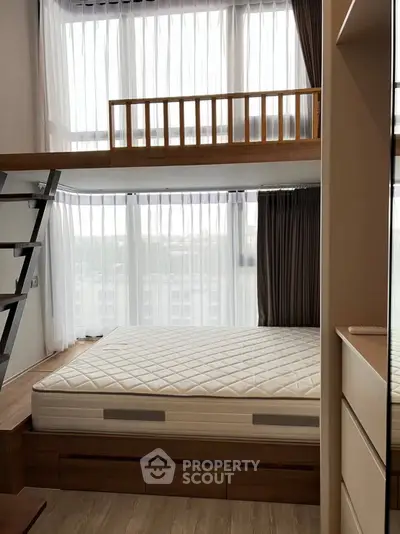 Modern loft bedroom with large windows and stylish wooden accents