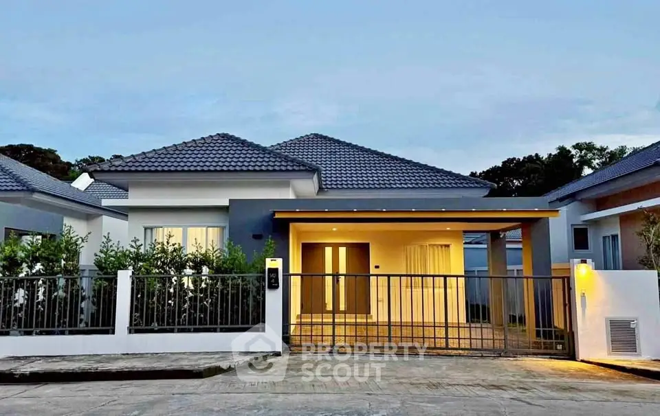 Charming modern bungalow with sleek design and gated entrance, perfect for family living.