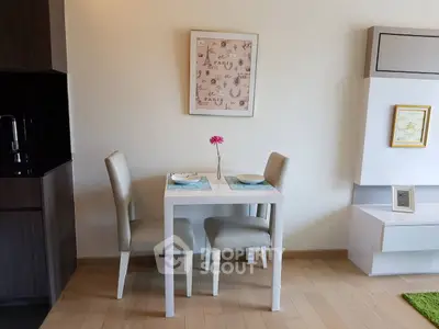 Charming dining nook with modern decor and elegant table setting in a cozy apartment.
