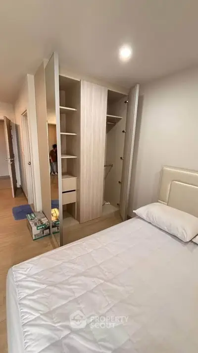 Modern bedroom with built-in wardrobe and cozy ambiance